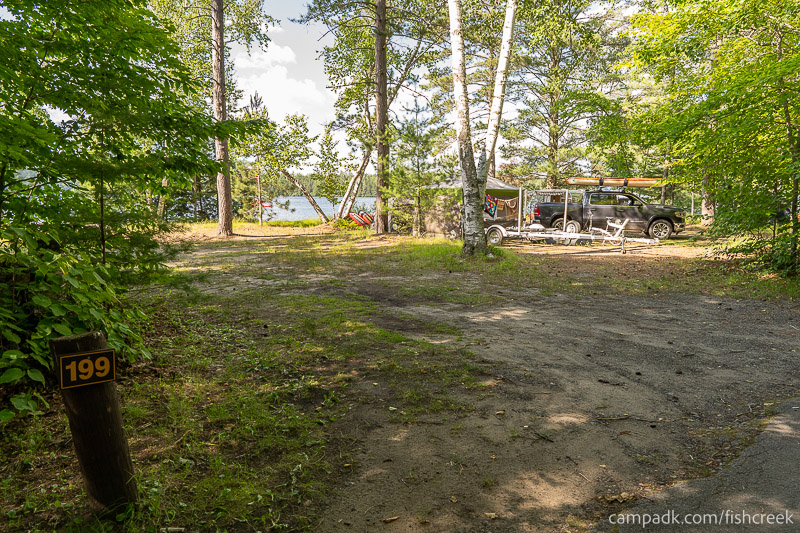 Campsite Photo of Site 227 at Fish Creek Pond Campground, New York - Looking at Site from Road Sign Visible