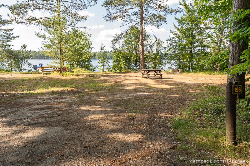 Campsite Photo of Site 224 at Fish Creek Pond Campground, New York - Looking at Site from Road Sign Visible