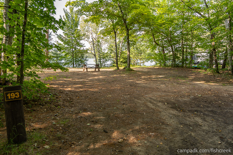 Campsite Photo of Site 221 at Fish Creek Pond Campground, New York - Looking at Site from Road Sign Visible