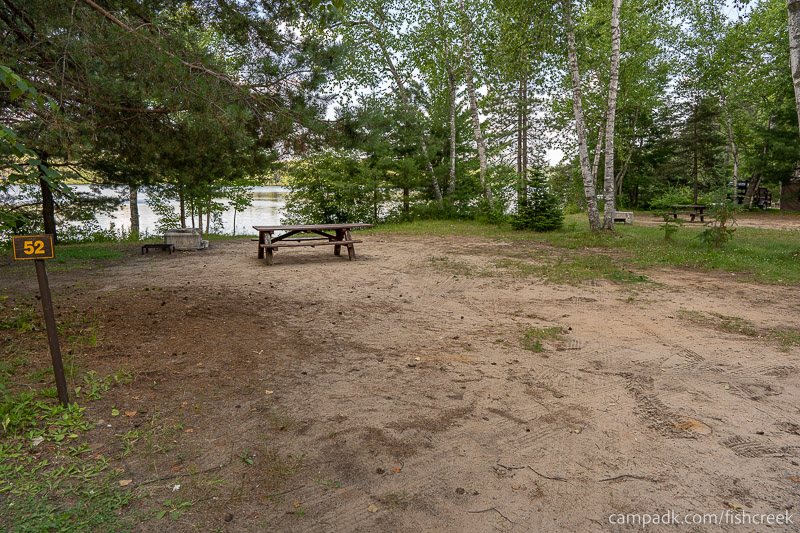 Campsite Photo of Site 62 at Fish Creek Pond Campground, New York - Looking at Site from Road Sign Visible