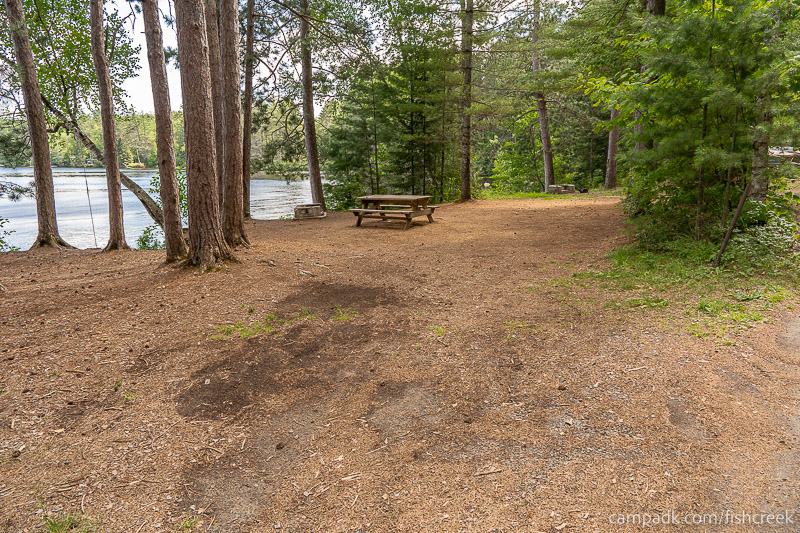 Campsite Photo of Site 154 at Fish Creek Pond Campground, New York - Looking at Site from Road Sign Visible