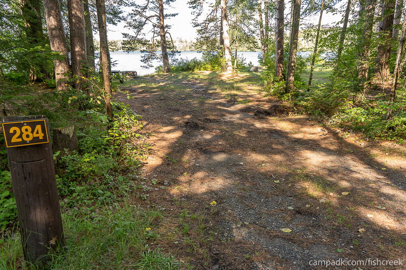 Campsite Photo of Site 312 at Fish Creek Pond Campground, New York - Looking at Site from Road Sign Visible