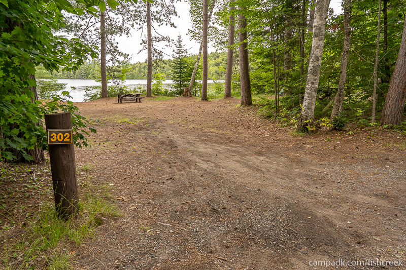 Campsite Photo of Site 328 at Fish Creek Pond Campground, New York - Looking at Site from Road Sign Visible