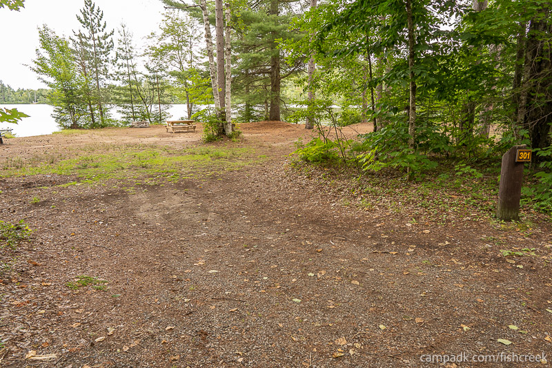 Campsite Photo of Site 327 at Fish Creek Pond Campground, New York - Looking at Site from Road Sign Visible