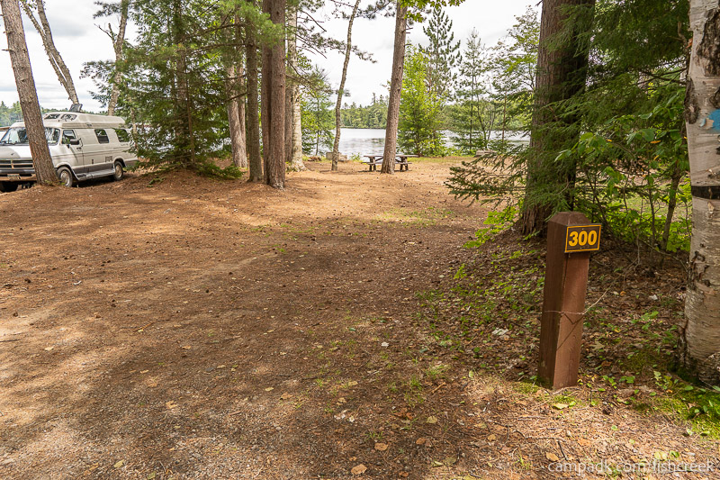 Campsite Photo of Site 326 at Fish Creek Pond Campground, New York - Looking at Site from Road Sign Visible