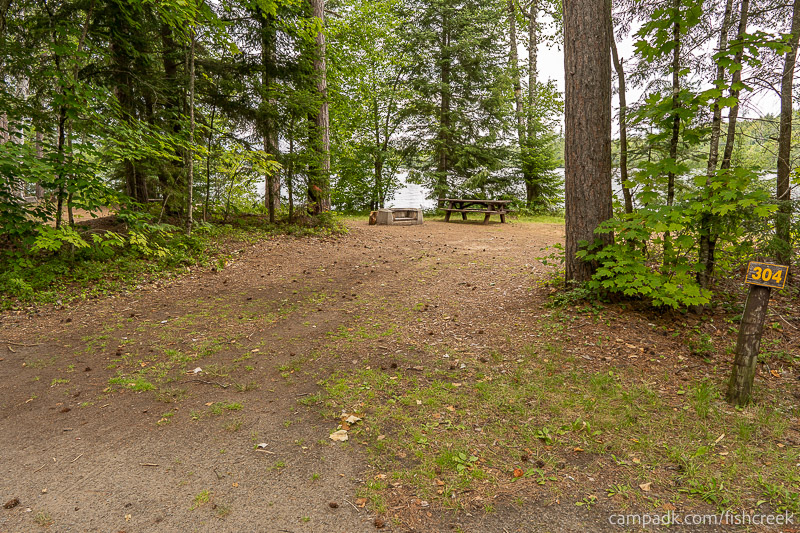 Campsite Photo of Site 330 at Fish Creek Pond Campground, New York - Looking at Site from Road Sign Visible