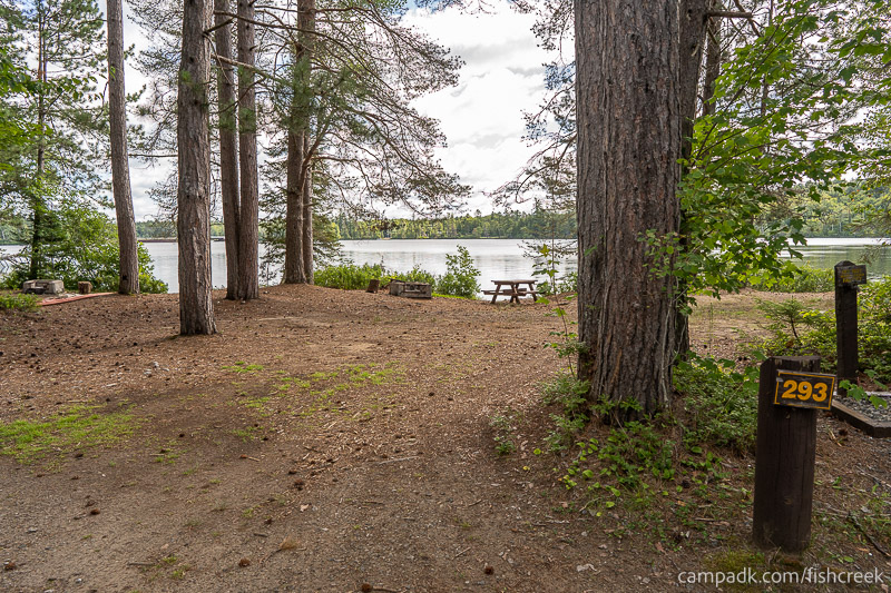 Campsite Photo of Site 319 at Fish Creek Pond Campground, New York - Looking at Site from Road Sign Visible