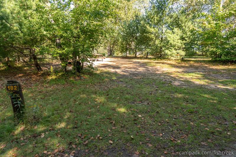 Campsite Photo of Site 211 at Fish Creek Pond Campground, New York - Looking at Site from Road Sign Visible
