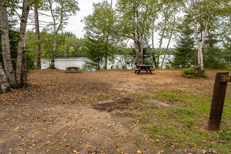 Campsite Photo of Site 208 at Fish Creek Pond Campground, New York - Looking at Site from Road Sign Visible