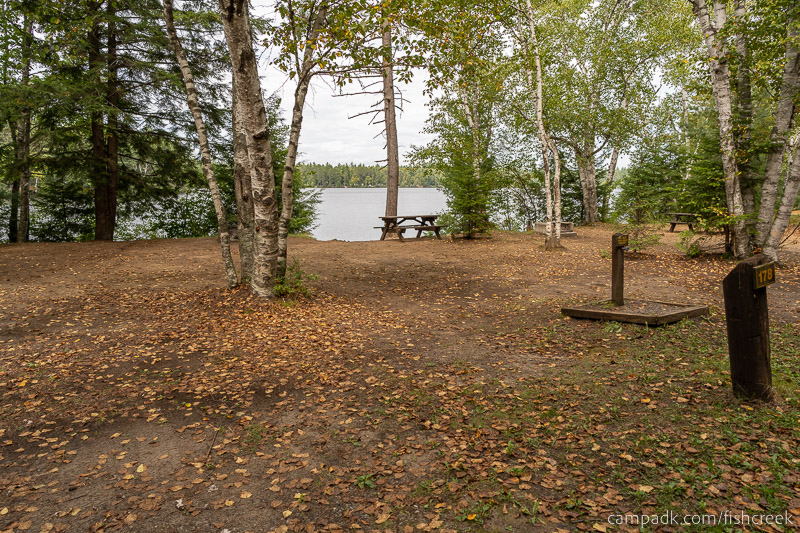 Campsite Photo of Site 207 at Fish Creek Pond Campground, New York - Looking at Site from Road Sign Visible