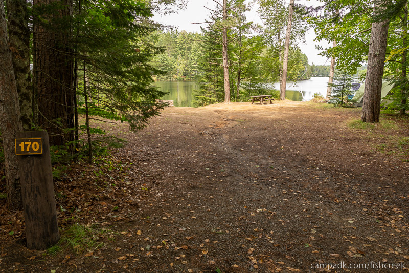 Campsite Photo of Site 199 at Fish Creek Pond Campground, New York - Looking at Site from Road Sign Visible