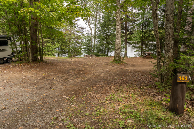 Campsite Photo of Site 193 at Fish Creek Pond Campground, New York - Looking at Site from Road Sign Visible