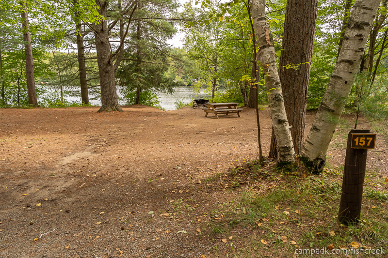 Campsite Photo of Site 187 at Fish Creek Pond Campground, New York - Looking at Site from Road Sign Visible