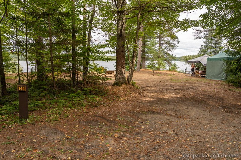 Campsite Photo of Site 174 at Fish Creek Pond Campground, New York - Looking at Site from Road Sign Visible