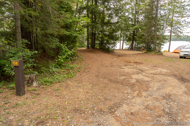 Campsite Photo of Site 168 at Fish Creek Pond Campground, New York - Looking at Site from Road Sign Visible