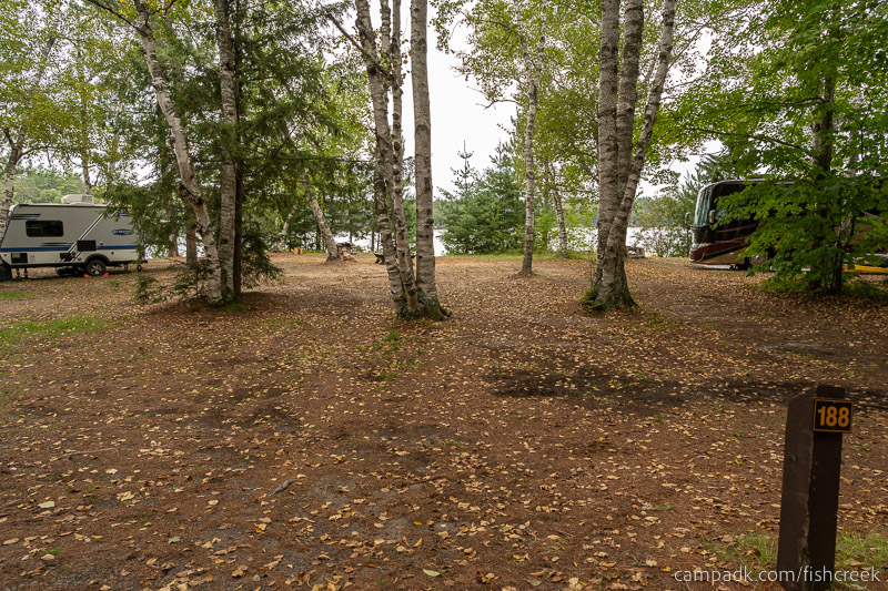 Campsite Photo of Site 216 at Fish Creek Pond Campground, New York - Looking at Site from Road Sign Visible
