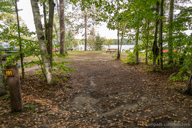 Campsite Photo of Site 219 at Fish Creek Pond Campground, New York - Looking at Site from Road Sign Visible