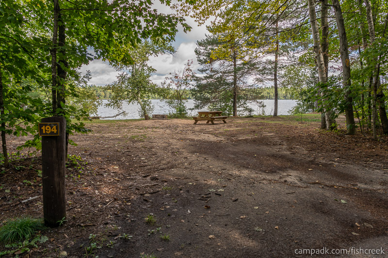 Campsite Photo of Site 222 at Fish Creek Pond Campground, New York - Looking at Site from Road Sign Visible