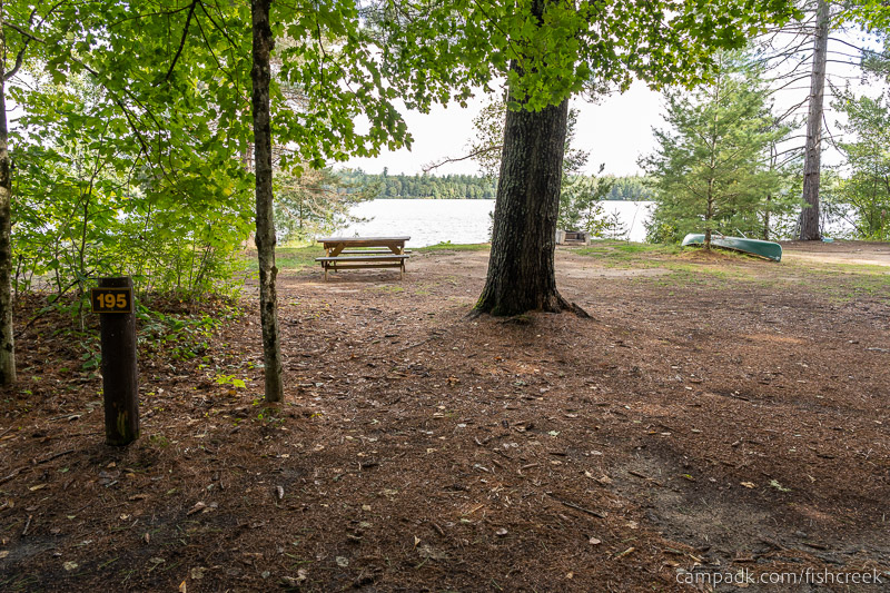 Campsite Photo of Site 223 at Fish Creek Pond Campground, New York - Looking at Site from Road Sign Visible