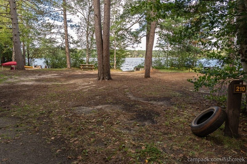 Campsite Photo of Site 238 at Fish Creek Pond Campground, New York - Looking at Site from Road Sign Visible