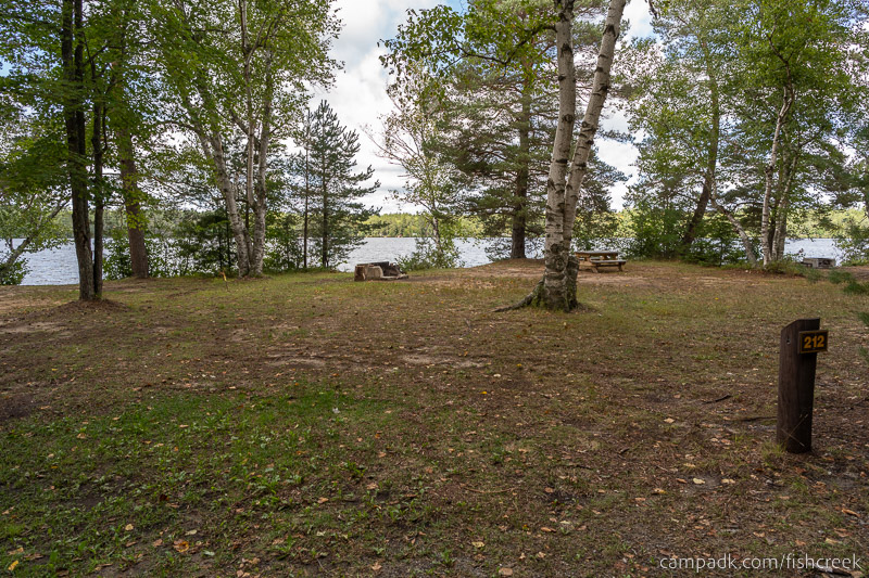 Campsite Photo of Site 240 at Fish Creek Pond Campground, New York - Looking at Site from Road Sign Visible