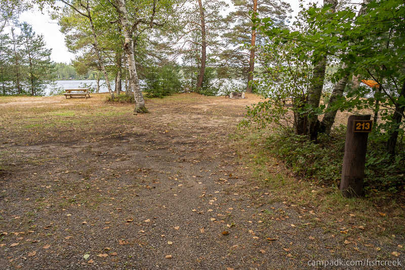 Campsite Photo of Site 241 at Fish Creek Pond Campground, New York - Looking at Site from Road Sign Visible