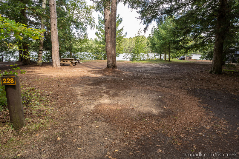 Campsite Photo of Site 256 at Fish Creek Pond Campground, New York - Looking at Site from Road Sign Visible