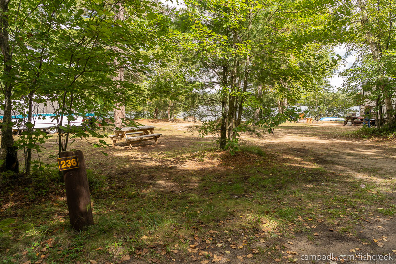 Campsite Photo of Site 264 at Fish Creek Pond Campground, New York - Looking at Site from Road Sign Visible