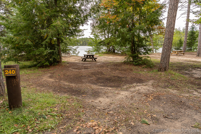 Campsite Photo of Site 268 at Fish Creek Pond Campground, New York - Looking at Site from Road Sign Visible