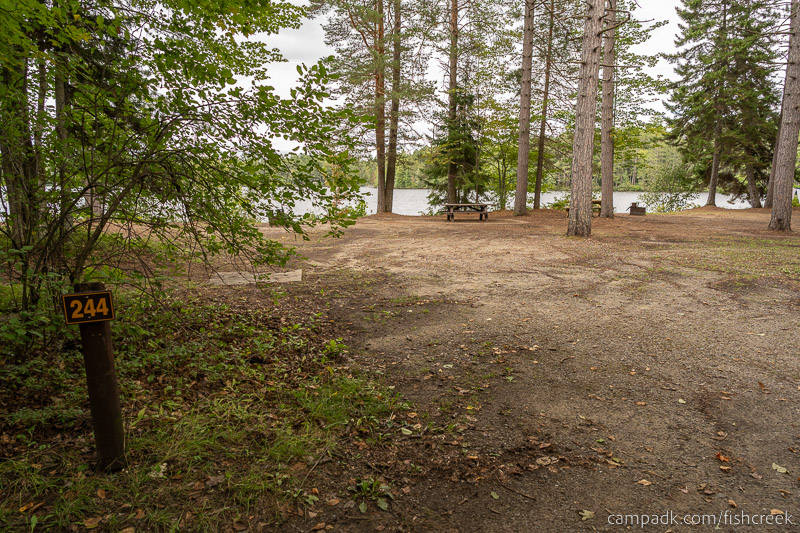 Campsite Photo of Site 272 at Fish Creek Pond Campground, New York - Looking at Site from Road Sign Visible