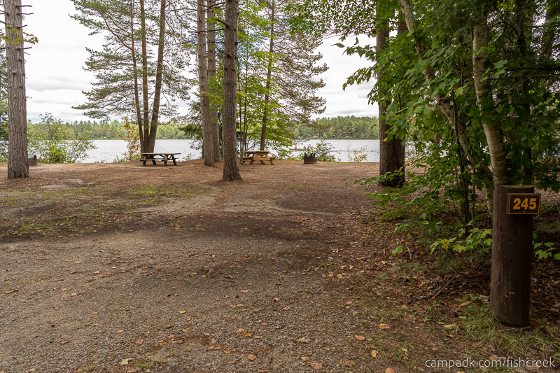 Campsite Photo of Site 273 at Fish Creek Pond Campground, New York - Looking at Site from Road Sign Visible
