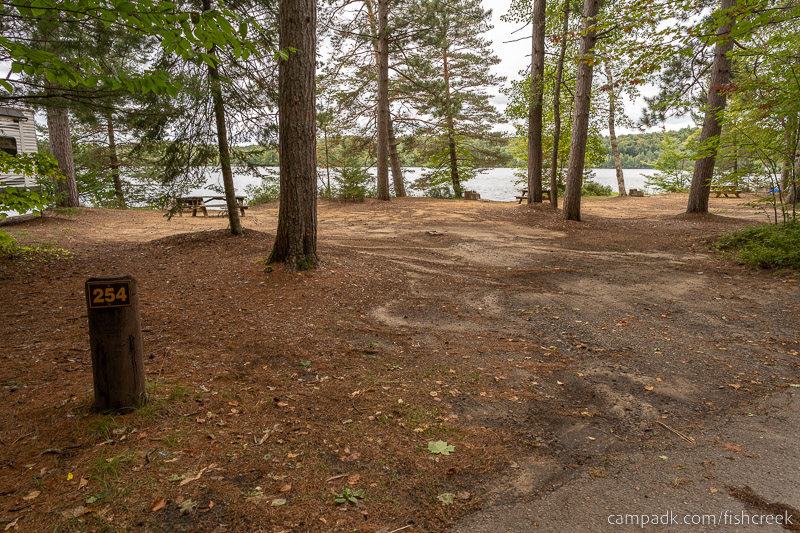 Campsite Photo of Site 282 at Fish Creek Pond Campground, New York - Looking at Site from Road Sign Visible