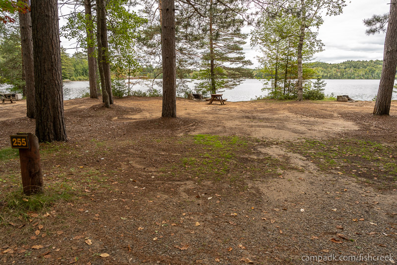 Campsite Photo of Site 283 at Fish Creek Pond Campground, New York - Looking at Site from Road Sign Visible