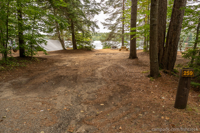 Campsite Photo of Site 287 at Fish Creek Pond Campground, New York - Looking at Site from Road Sign Visible