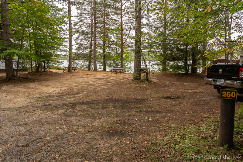Campsite Photo of Site 288 at Fish Creek Pond Campground, New York - Looking at Site from Road Sign Visible