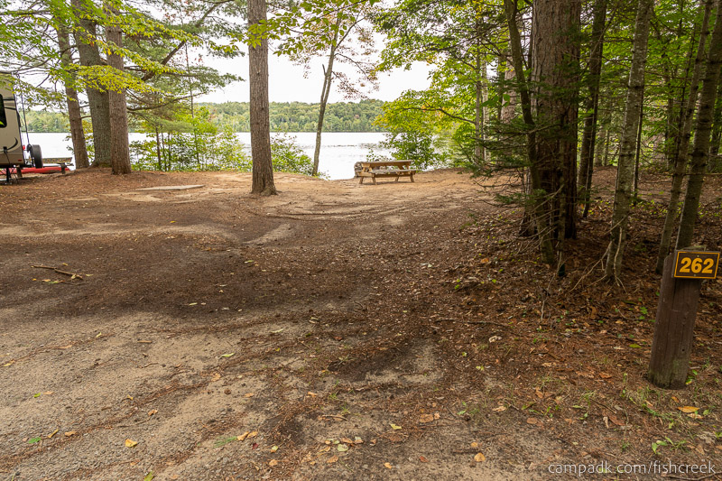 Campsite Photo of Site 290 at Fish Creek Pond Campground, New York - Looking at Site from Road Sign Visible