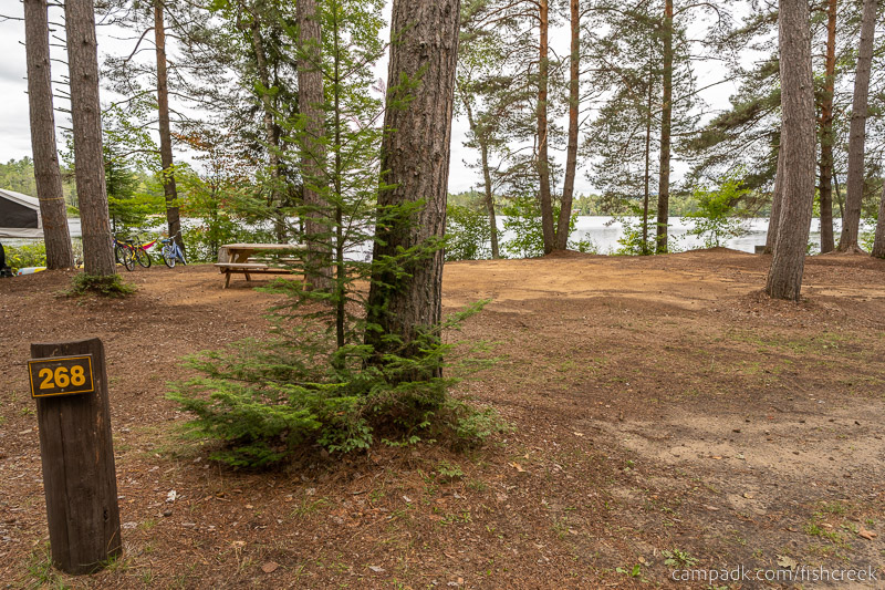 Campsite Photo of Site 296 at Fish Creek Pond Campground, New York - Looking at Site from Road Sign Visible