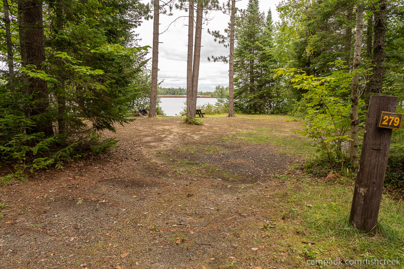 Campsite Photo of Site 307 at Fish Creek Pond Campground, New York - Looking at Site from Road Sign Visible