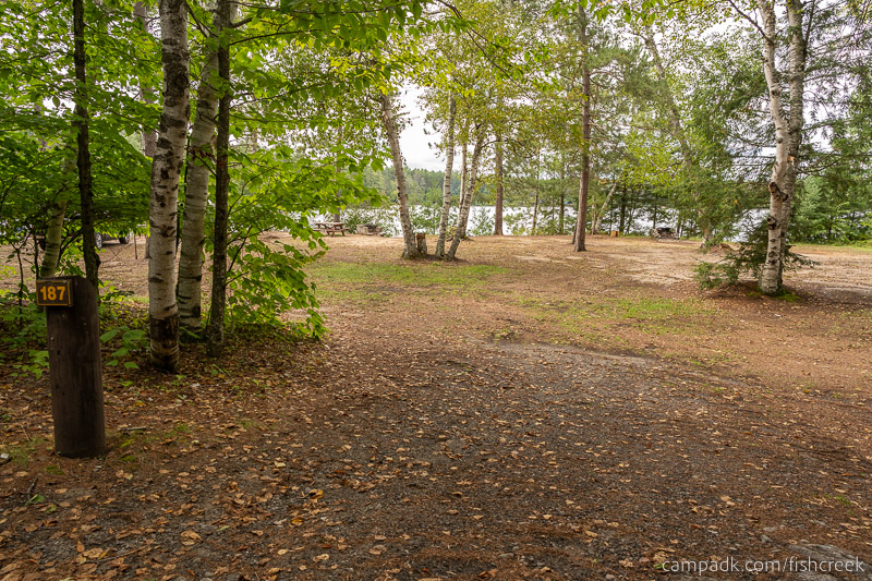 Campsite Photo of Site 215 at Fish Creek Pond Campground, New York - Looking at Site from Road Sign Visible