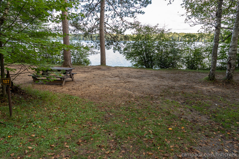 Campsite Photo of Site 139 at Fish Creek Pond Campground, New York - Looking at Site from Road Sign Visible