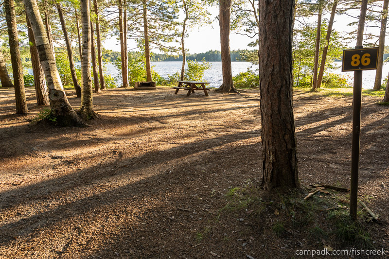 Campsite Photo of Site 118 at Fish Creek Pond Campground, New York - Looking at Site from Road Sign Visible