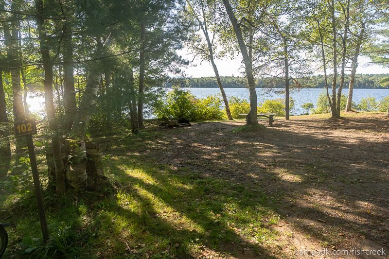 Campsite Photo of Site 134 at Fish Creek Pond Campground, New York - Looking at Site from Road Sign Visible
