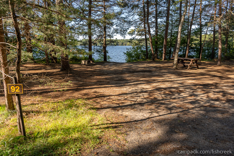 Campsite Photo of Site 124 at Fish Creek Pond Campground, New York - Looking at Site from Road Sign Visible