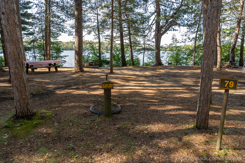 Campsite Photo of Site 111 at Fish Creek Pond Campground, New York - Looking at Site from Road Sign Visible