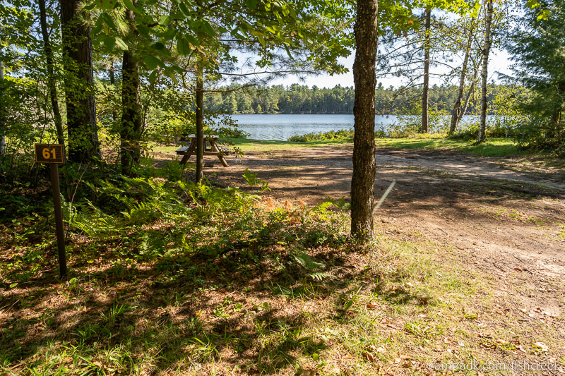 Campsite Photo of Site 77 at Fish Creek Pond Campground, New York - Looking at Site from Road Sign Visible