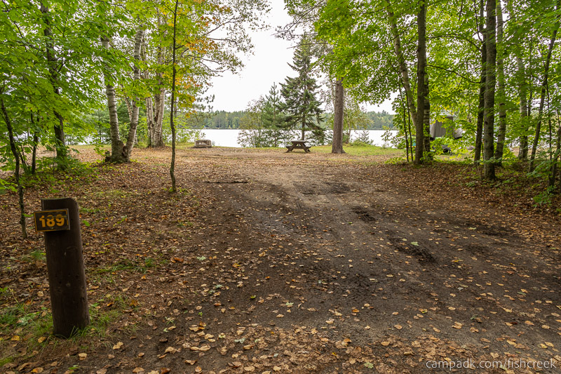 Campsite Photo of Site 217 at Fish Creek Pond Campground, New York - Looking at Site from Road Sign Visible