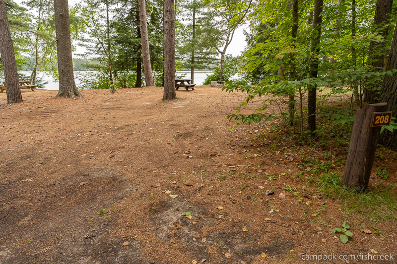 Campsite Photo of Site 236 at Fish Creek Pond Campground, New York - Looking at Site from Road Sign Visible
