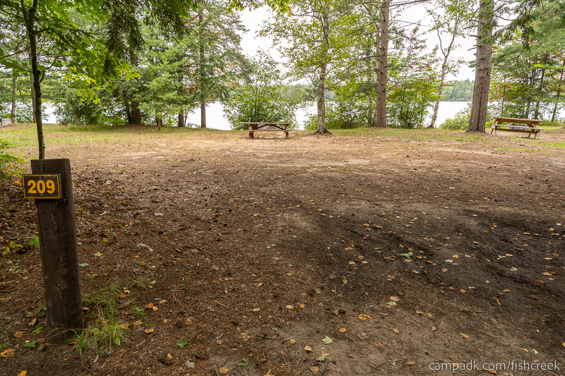 Campsite Photo of Site 237 at Fish Creek Pond Campground, New York - Looking at Site from Road Sign Visible