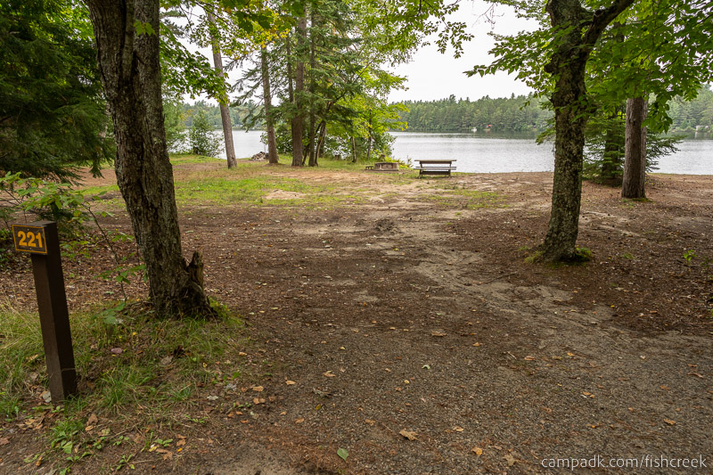 Campsite Photo of Site 249 at Fish Creek Pond Campground, New York - Looking at Site from Road Sign Visible