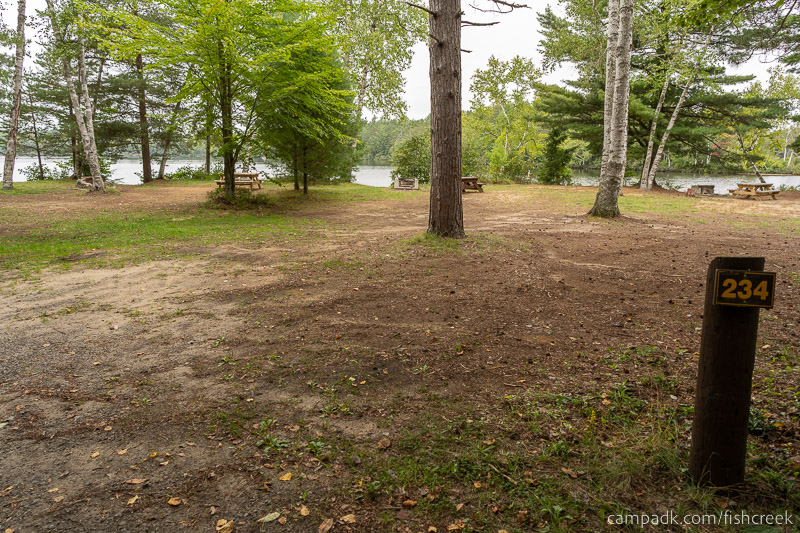 Campsite Photo of Site 262 at Fish Creek Pond Campground, New York - Looking at Site from Road Sign Visible